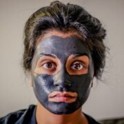 woman with gray facial mask, skin,