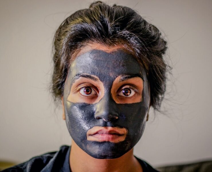woman with gray facial mask, skin,