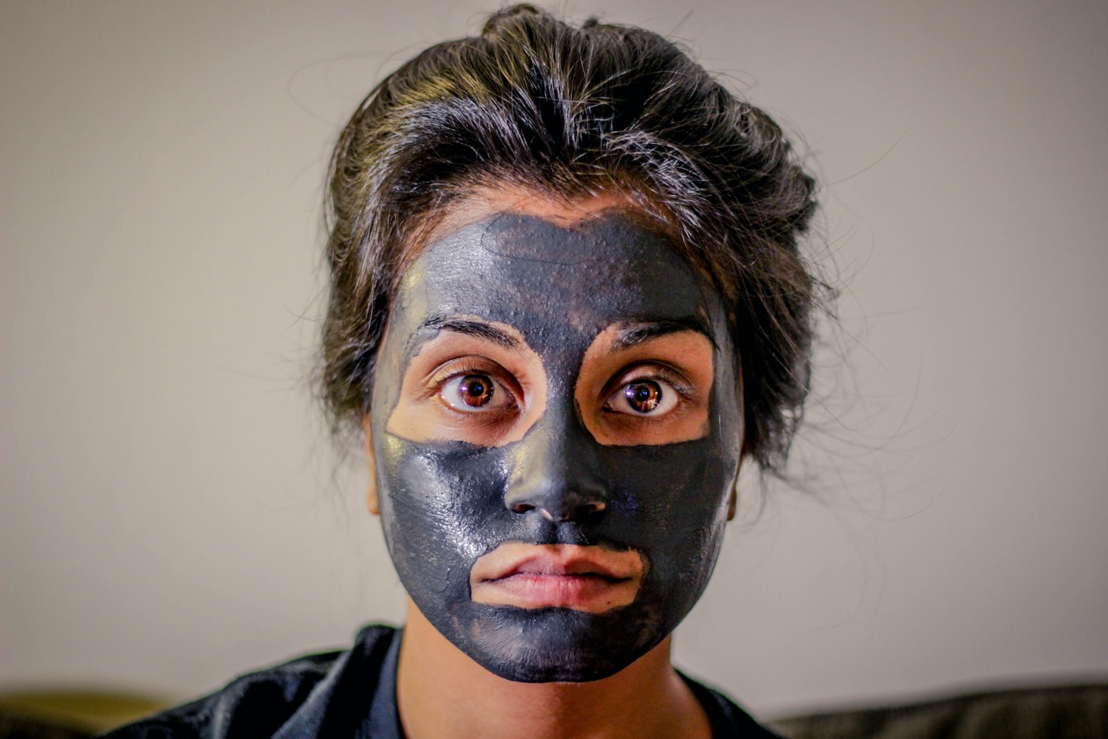 woman with gray facial mask, skin,