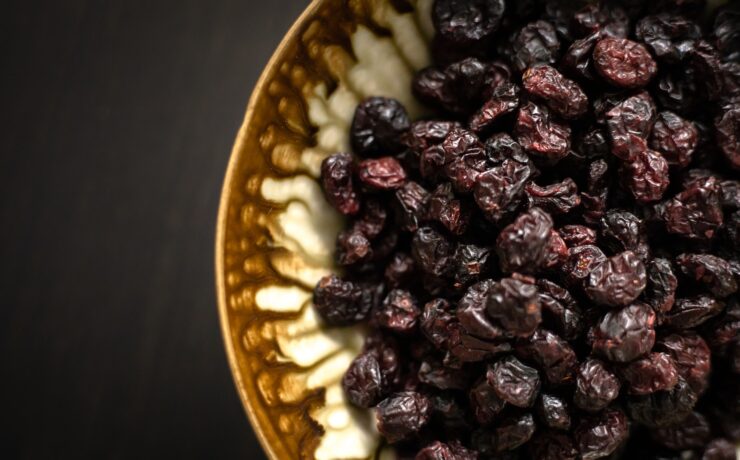 black berries on yellow ceramic plate