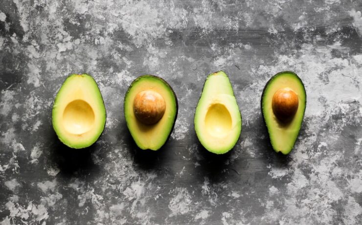 three pieces of avocado sitting on top of a table