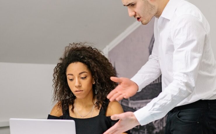 A Man Talking to a Woman boss office angry toxic