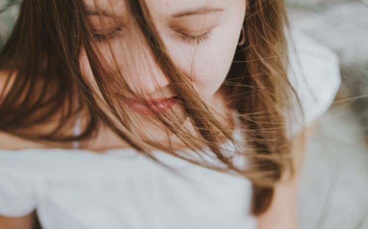 woman meditating with closed eyes