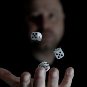 a man is throwing dices into the air