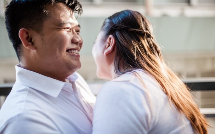 man and woman laughing together