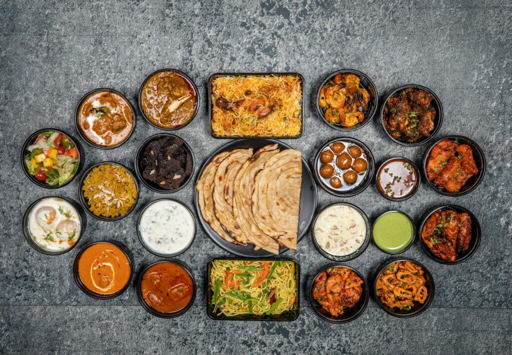 Wide variety of traditional Indian dishes displayed together in a flat lay style.