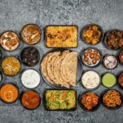 Wide variety of traditional Indian dishes displayed together in a flat lay style.