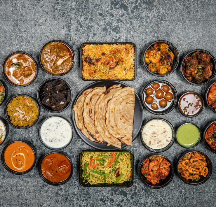 Wide variety of traditional Indian dishes displayed together in a flat lay style.