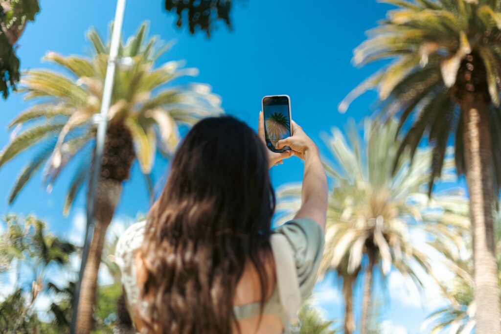 A woman taking a picture with her cell phone