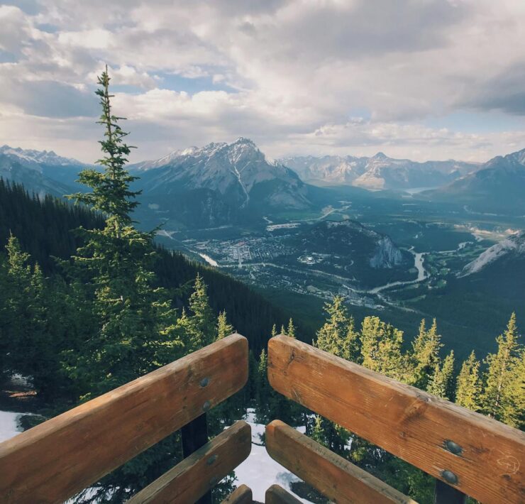 Breathtaking view of Banff National Park with mountains and evergreen trees.