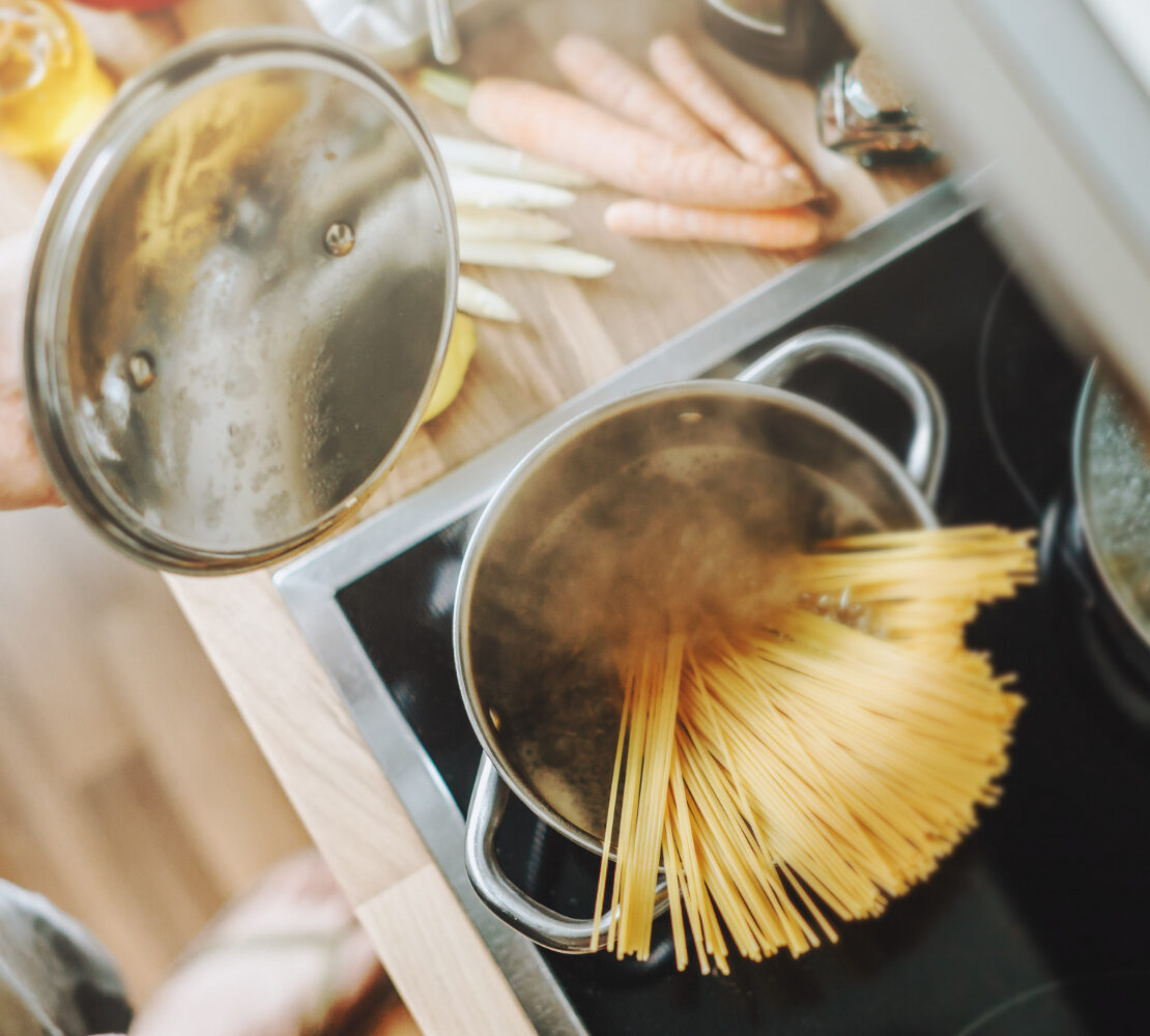 cooking pasta in the kitchen