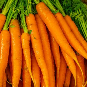 a pile of carrots sitting next to each other
