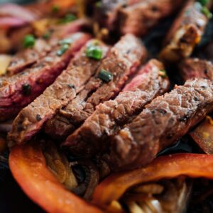 grilled sausage on orange plate