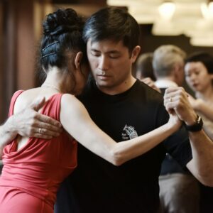 people dancing tango inside room