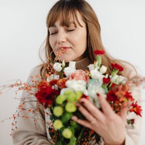 woman smelling flowers