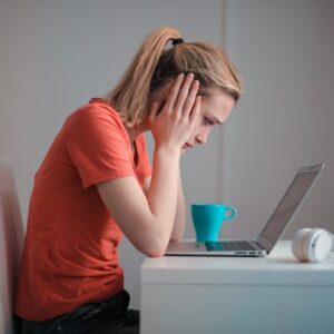 negative serious woman laptop