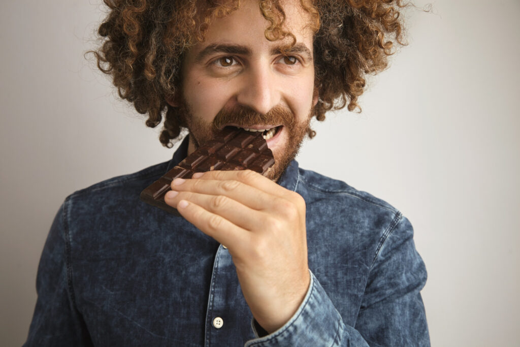 man eating chocolate