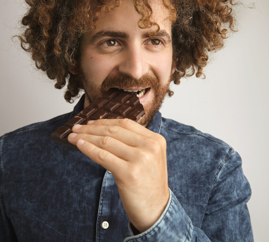 man eating chocolate
