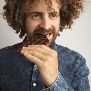 man eating chocolate