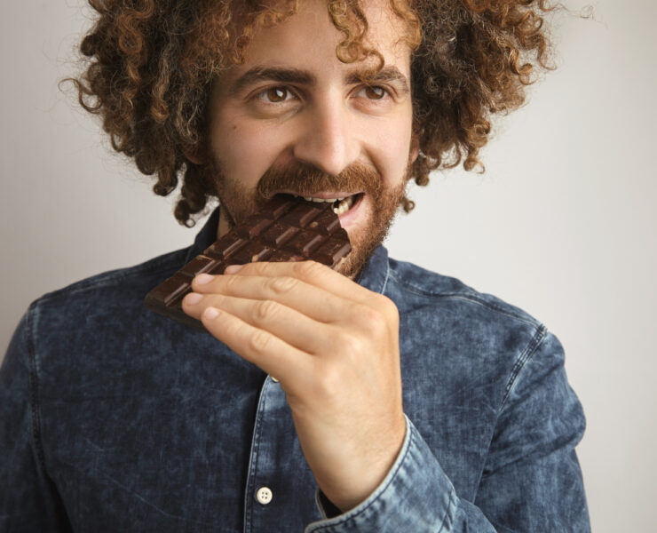 man eating chocolate