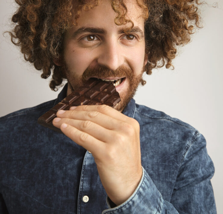 man eating chocolate