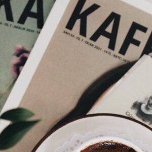 Turkish coffee served in a cozy setting with literature and greenery.