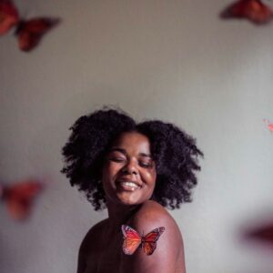 woman surrounded by butterflies