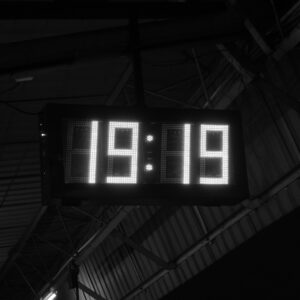 A black and white photo of a clock