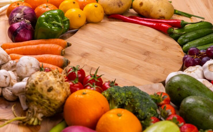 orange and green vegetables on brown wooden table