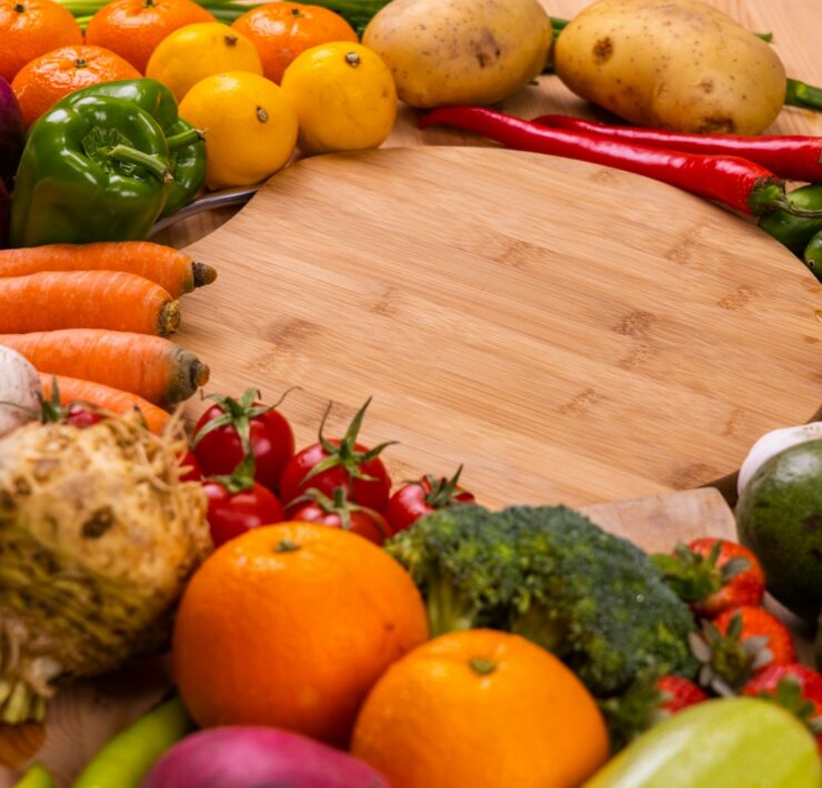 orange and green vegetables on brown wooden table