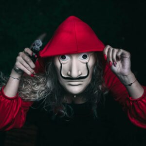 a person wearing a mask and a red hat