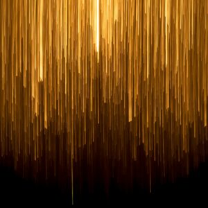 a very long line of yellow lines on a black background
