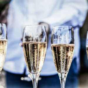 four clear champagne flutes