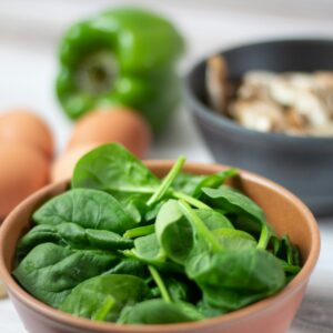 green vegetable on white ceramic bowl