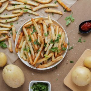 potato fries and sliced potato on white ceramic plate
